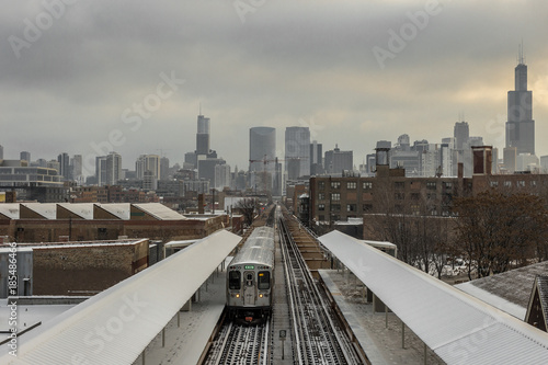 Chicago skyline with subway in foreground with snow