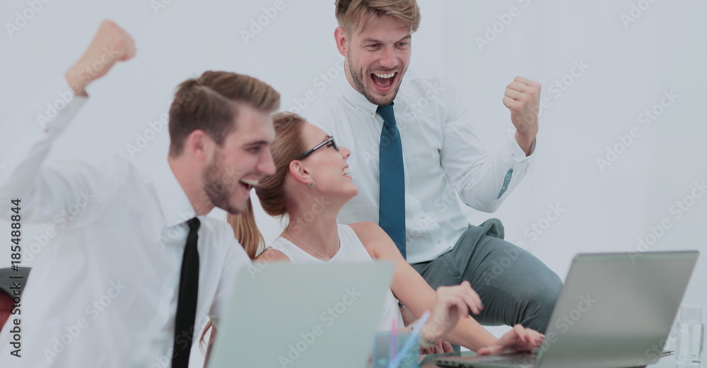 Business team celebrating a triumph with arms up Business team celebrating a triumph with arms up