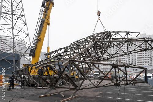 Moscow, Russia - December 21, 2017. The dismantling of the towers of high voltage lines in the city, near the metro station Chertanovskaya.
