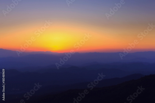 Silhouettes of the mountain hills at sunset. mountain cascade