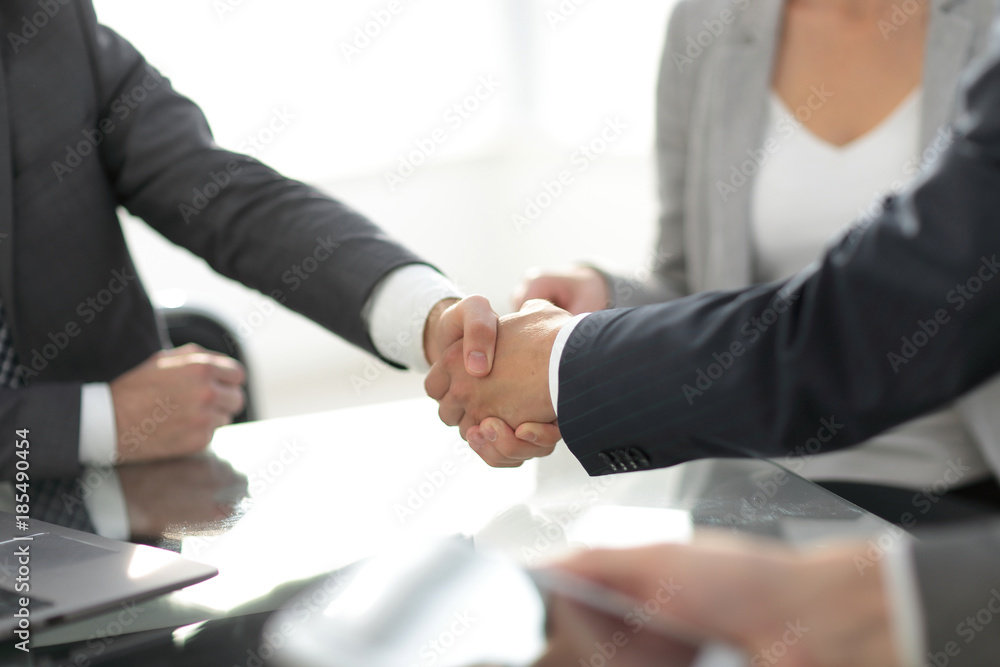 confident handshake of business partners confident handshake of business partners
