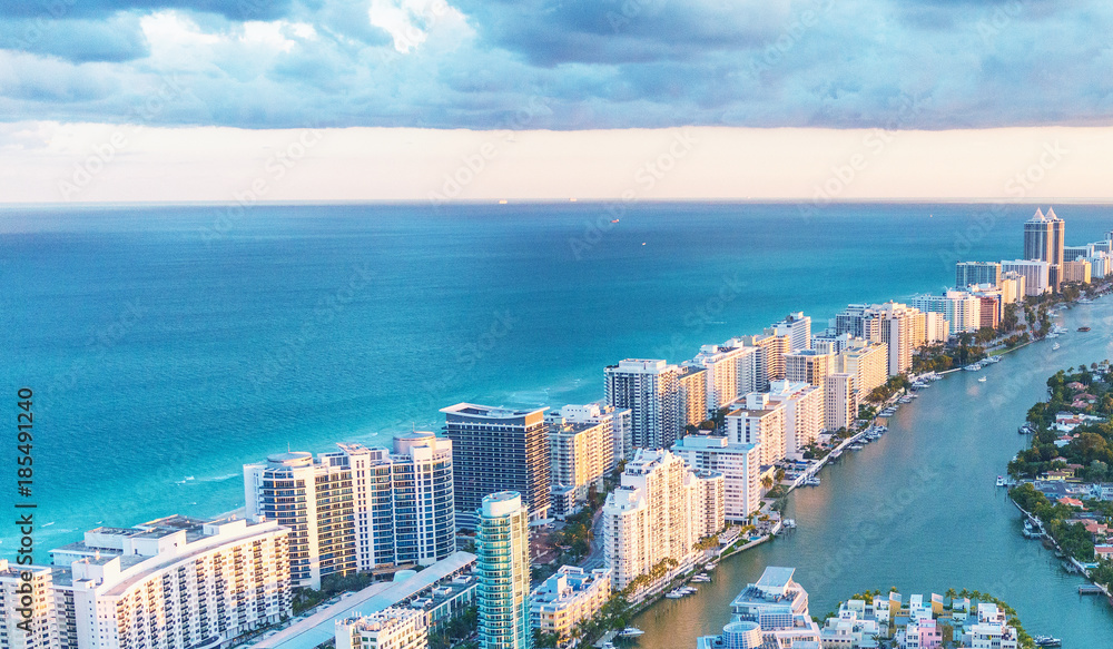 Naklejka premium Miami Beach skyscrapers at dusk, Florida. Beautiful view from helicopter