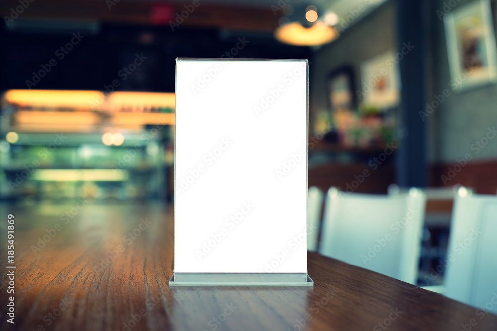 Mock up Menu frame standing on wood table in Bar restaurant cafe. space for text. Mock up Menu frame standing on wood table in Bar restaurant cafe. space for text.