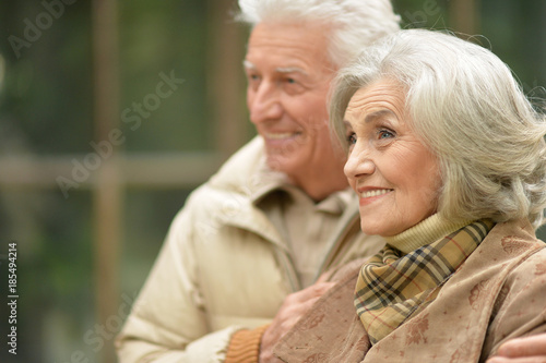 senior couple hugging in the park 