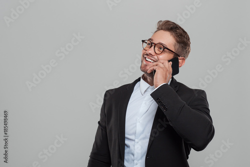 Man in suit speaking on phone