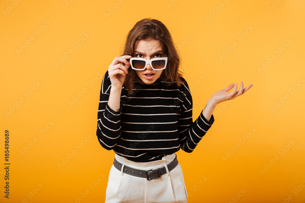 Portrait of confused girl in sunglasses Portrait of confused girl in sunglasses
