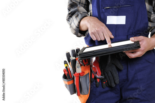 Young electrician technician in workwear isolated on white background.