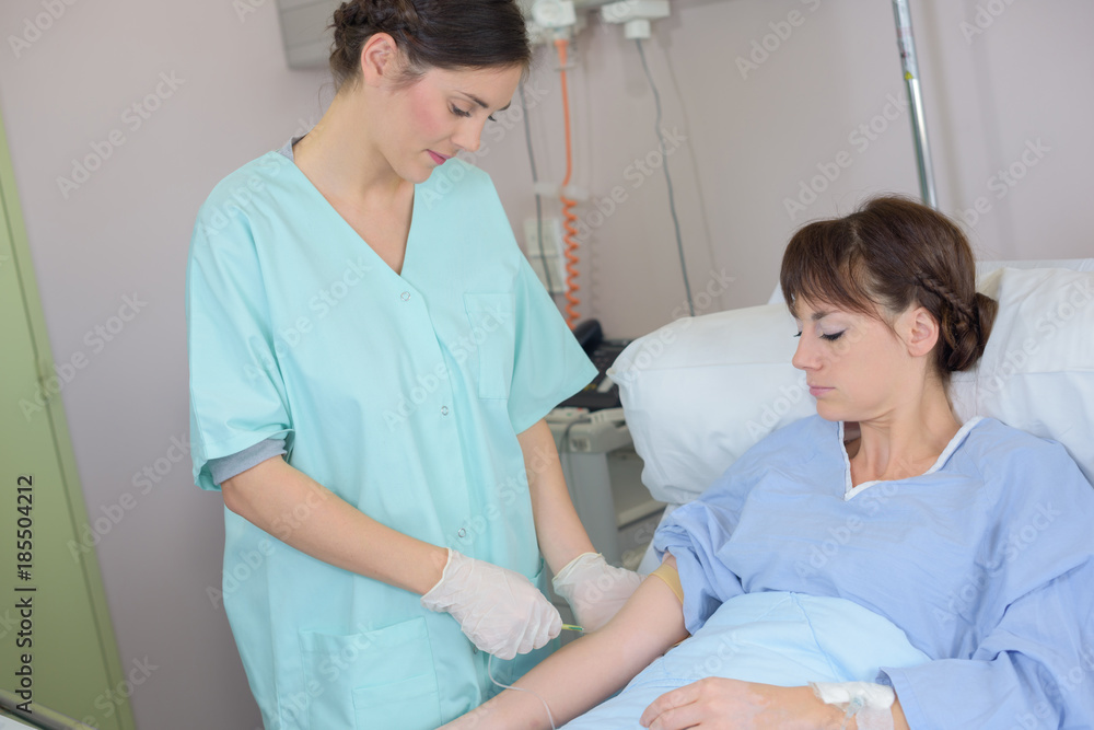 Obraz premium inserting of needle