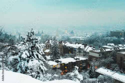 Winter panorama and aerial view from the Lion Hill on the downtown in Lviv, Ukraine. Old city and buildings with roofs covered with snow