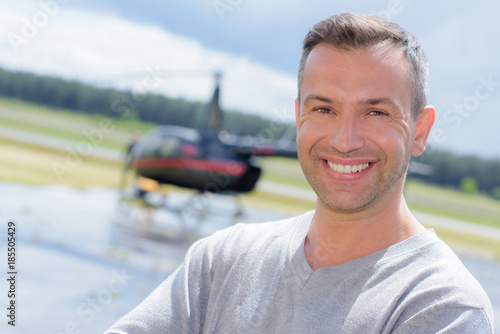 man with helicopter at the background