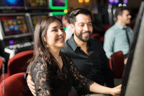 Happy couple having fun in a casino