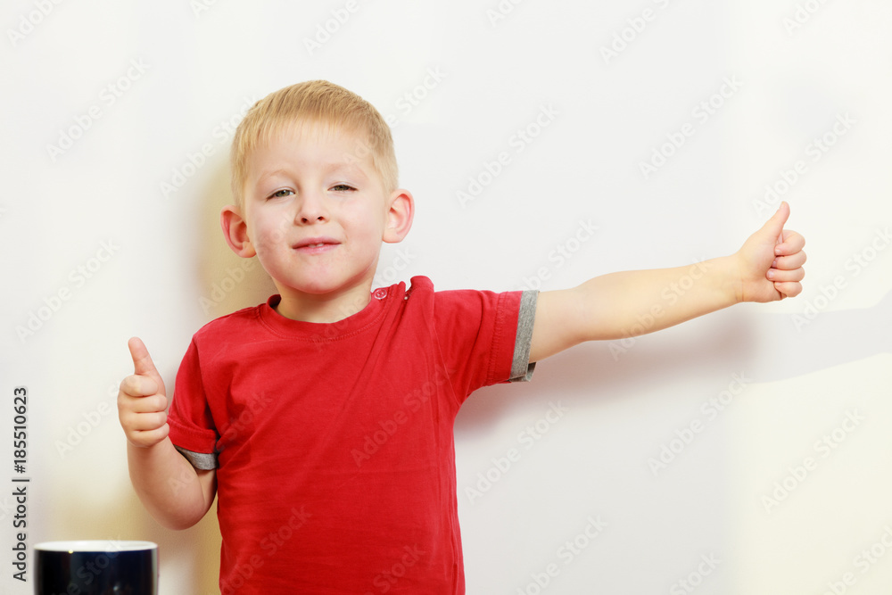 Little boy playing showing thumb up gesture Little boy playing showing thumb up gesture