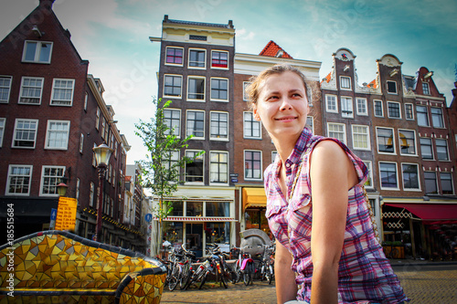 Caucasian girl tourist in Amsterdam. Holidays in Europe. Travel to the European city of Amsterdam, the Netherlands. vacations in Holland.