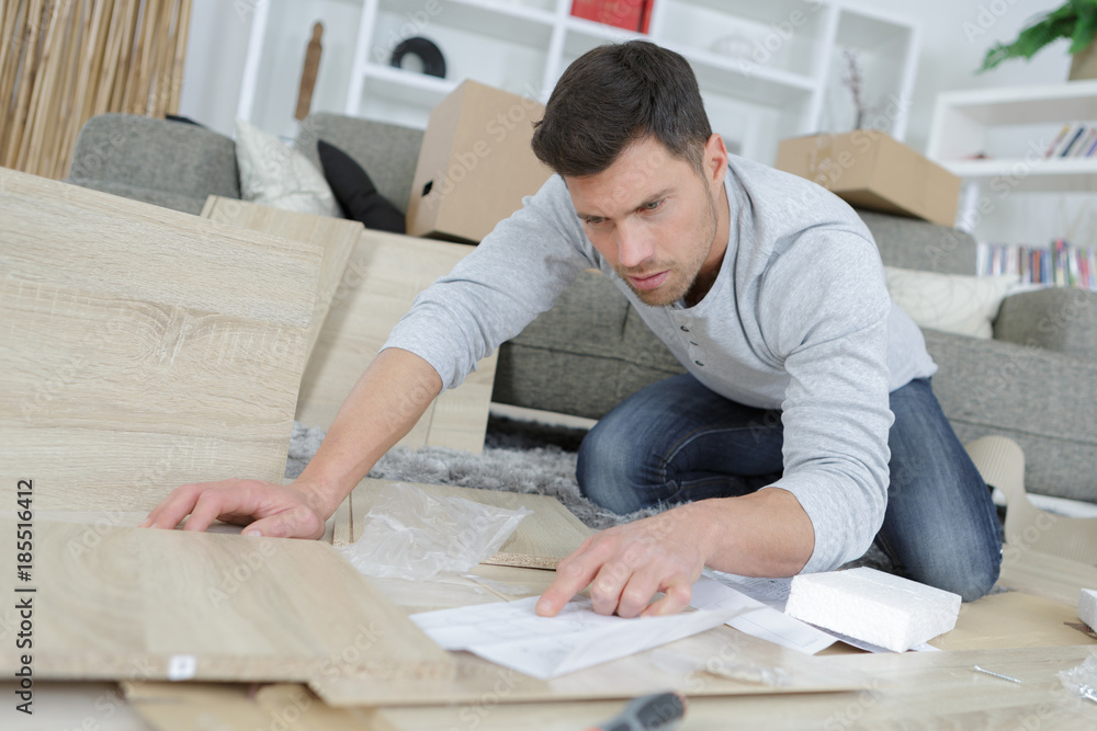 reading the instruction for the furniture reading the instruction for the furniture