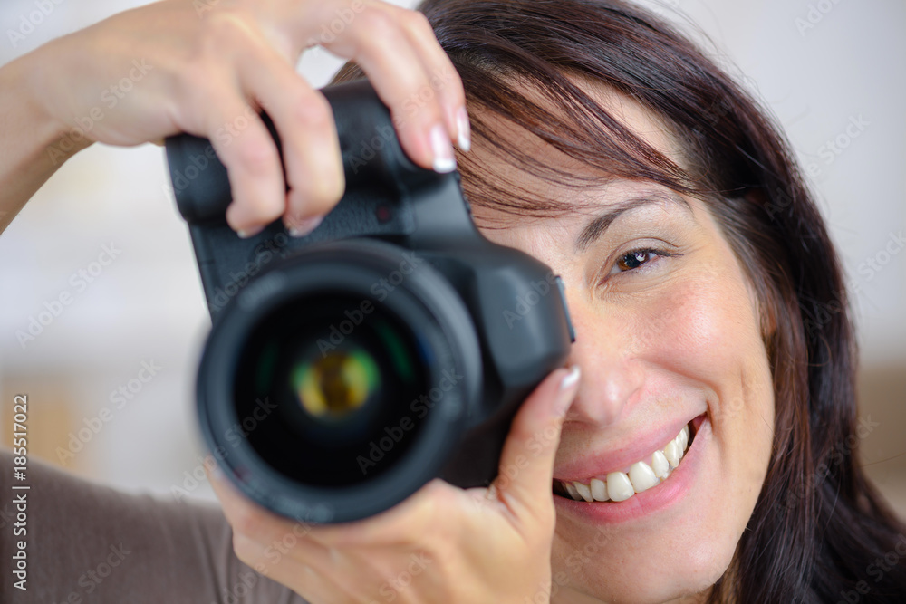 woman taking picture using dlsr woman taking picture using dlsr