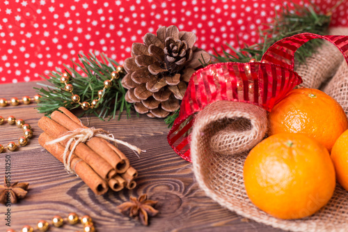 Christmas background - vintage wood, cinnamon, star anise, sweet mandarins, a New Year's decor.Top view, blank space