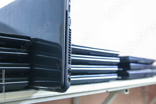 A stack of laptops. Closeup