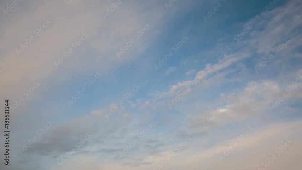 Russia, time lapse. Formation and rapid movement of white clouds of different shapes in the blue sky in late spring at sunset. Russia, time lapse. Formation and rapid movement of white clouds of different shapes in the blue sky in late spring at sunset.