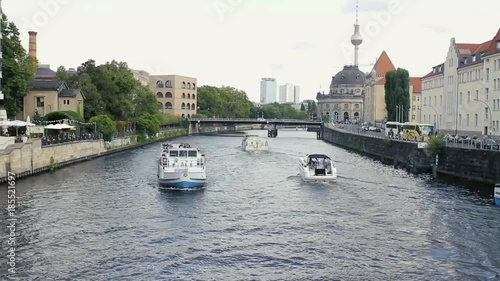 Pleasure boats around Moltke Bridge.This bridge over Spree River in Berlin, Germany photo