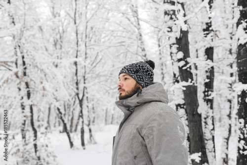 a man in a snowy forest