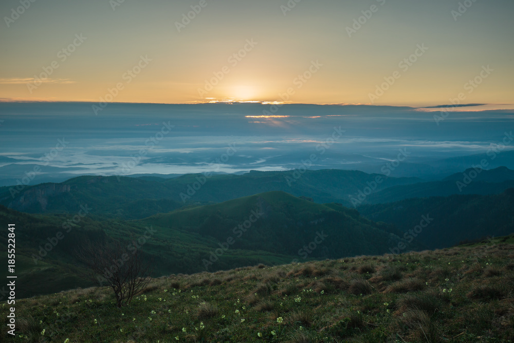 Obraz premium The formation and movement of clouds over the summer slopes of Adygea Bolshoy Thach and the Caucasus Mountains