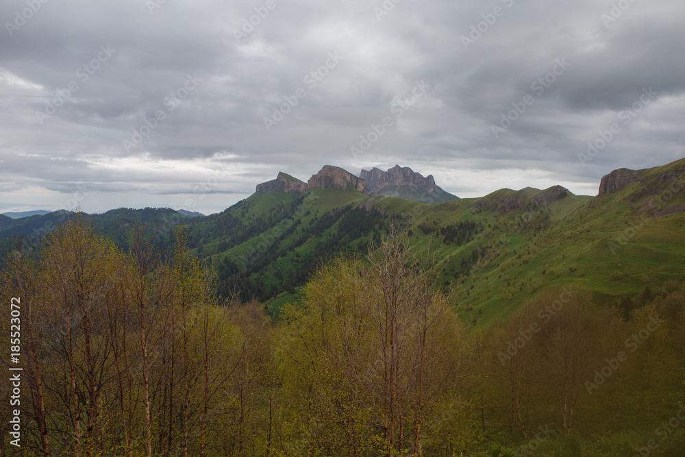 The formation and movement of clouds over the summer slopes of Adygea Bolshoy Thach and the Caucasus Mountains