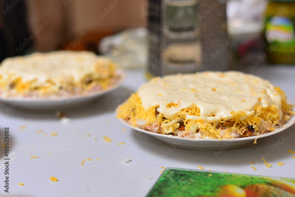 Cod liver salad with eggs, carrots, cheese, onions and potatoes. Salad with sour cream. Mimosa salad. Cod liver salad with eggs, carrots, cheese, onions and potatoes. Salad with sour cream. Mimosa salad.