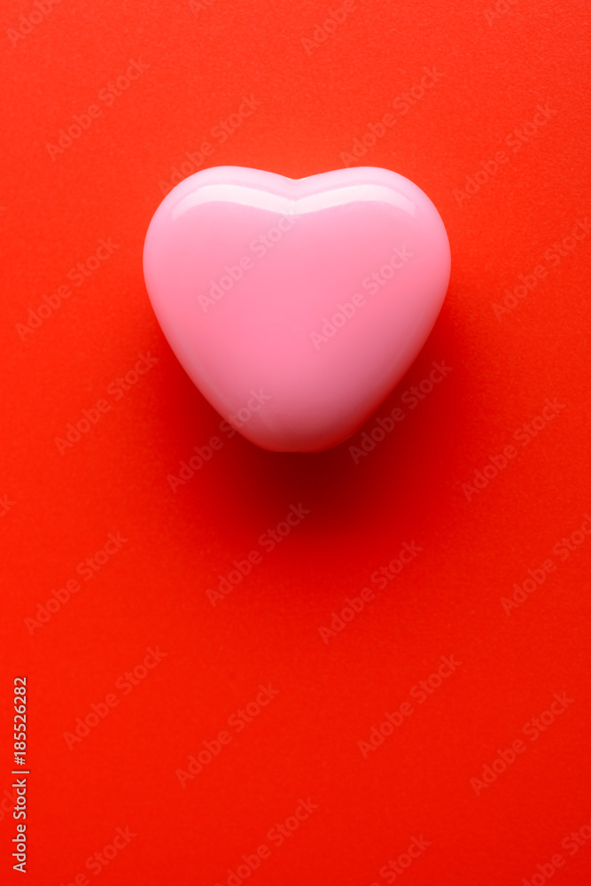 Small heart on red background