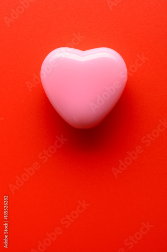 Small heart on red background