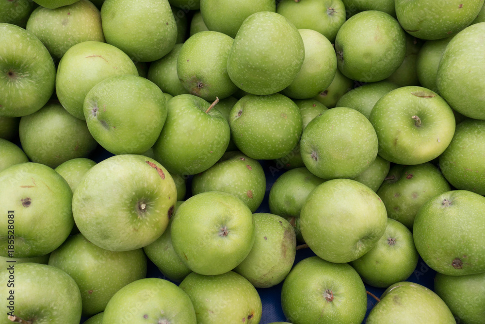 Fresh and Juicy Green Apples on Market Stall Ready For Sale