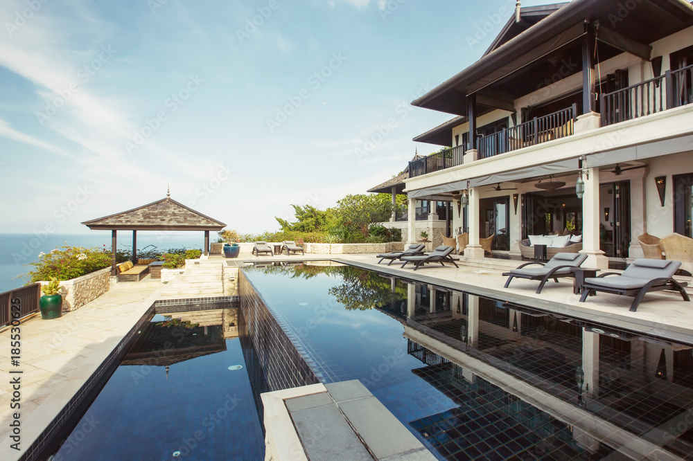Swimming pool with sea view in luxury villa interior