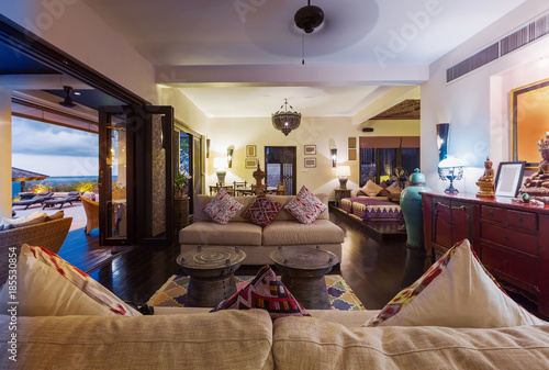 Tropical luxury villa interior, living room with sea view veranda © Annatamila