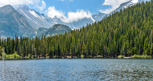 Bild auf Leinwand Bear Lake - Summer view of Bear Lake, with storm clouds passing over high mountain peaks of Continental Divide in background, Rocky Mountain National Park, Colorado, USA