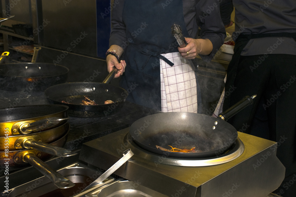 Chef Preparing Meal In A Wok Chef Preparing Meal In A Wok