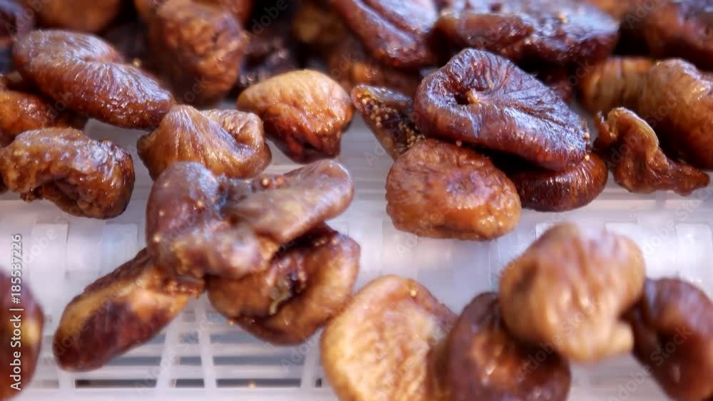 Dried figs on conveyor belt. Drying on industrial microw Dried figs on conveyor belt. Drying on industrial microw