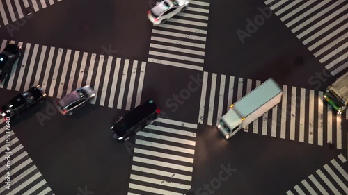 Trafffic crossing an interestion in Ginza, Tokyo at night photo