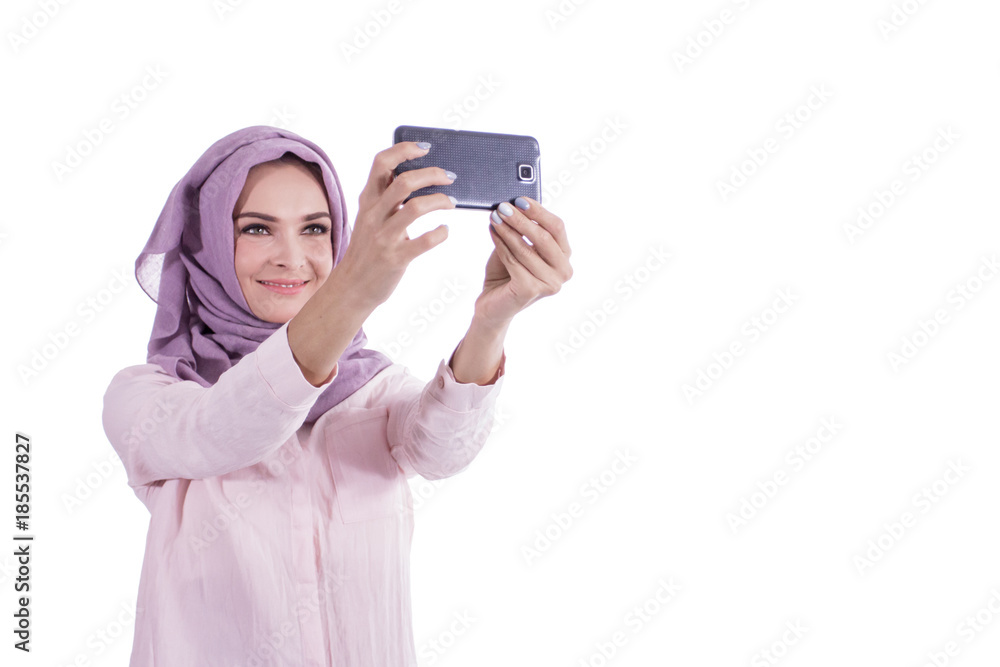 beautiful woman wearing hijab taking picture using mobile phone beautiful woman wearing hijab taking picture using mobile phone