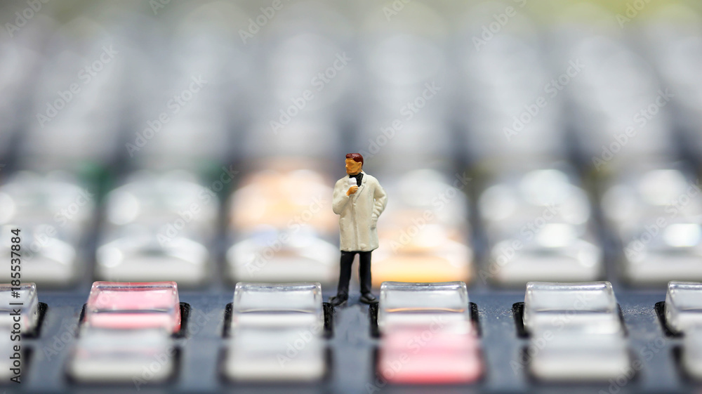 Obraz premium Miniature people : journalists , cameraman ,Videographer at work shooting on switcher control of Television Broadcast,color buttons