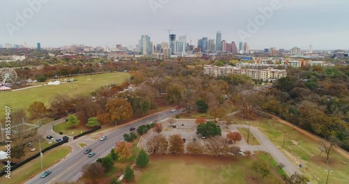 A daytime overcast aerial view of the Austin, Texas skyline from Zilker Metropolitan Park.  	 photo