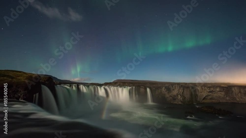 ICELAND –  2016 : Timelapse of amazing Northern Lights at Gódafoss waterfall at night with beautiful landscape in view