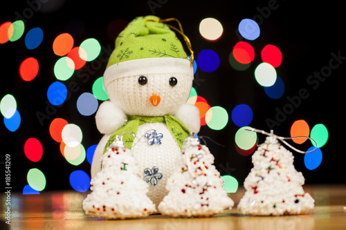 Festive snowman with Christmas light background