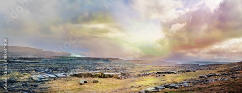 Valokuva Panoramic Irish landscape with stones, grass and  cloudy sky