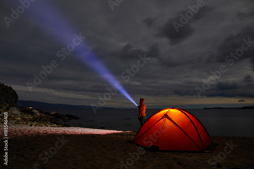 Night lit tent in camping by nature