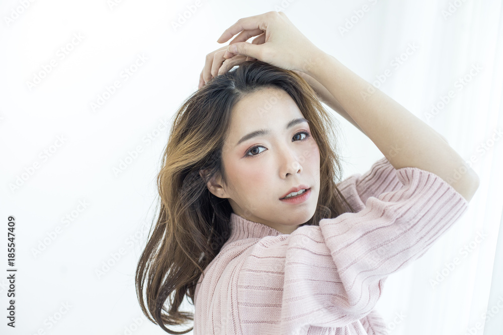 Attractive Asian Woman wake up on bed with happy emotion, People lifestyle concept.