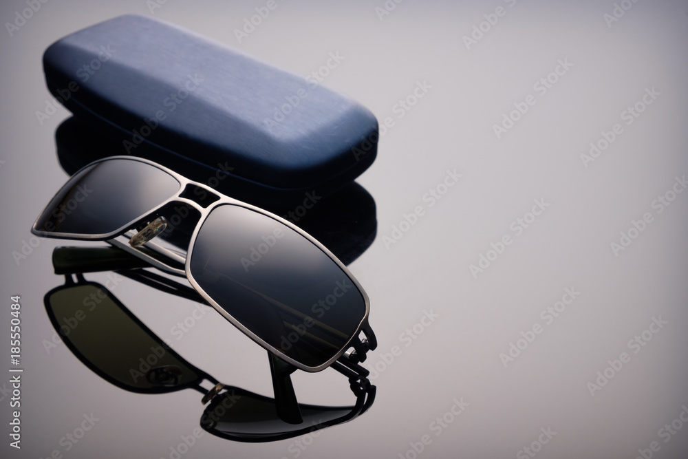 Sunglasses in box black glass with reflection Sunglasses in box black glass with reflection
