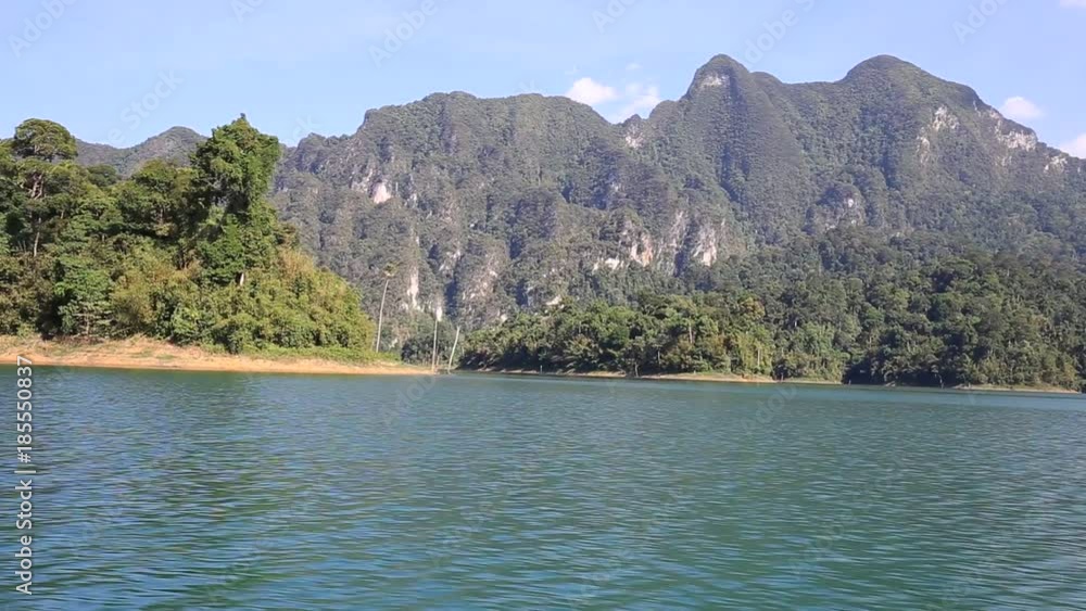 View sitting in a boat travel in lake at Khao Sok National Park, Surat Thani, Thailand. View sitting in a boat travel in lake at Khao Sok National Park, Surat Thani, Thailand.
