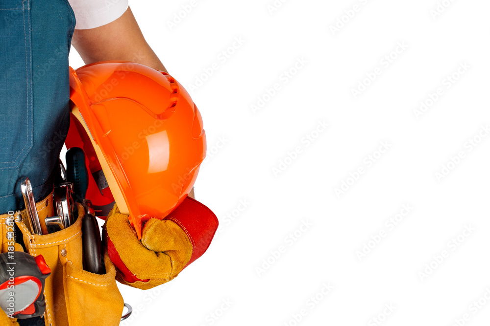 engineer or worker hand holding orange helmet for workers. over white wall background. repair, construction, building, people and maintenance concept. engineer or worker hand holding orange helmet for workers. over white wall background. repair, construction, building, people and maintenance concept.