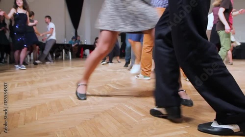 Dancers perform lindy hop dance at the swing festival. Dancing legs close up. photo