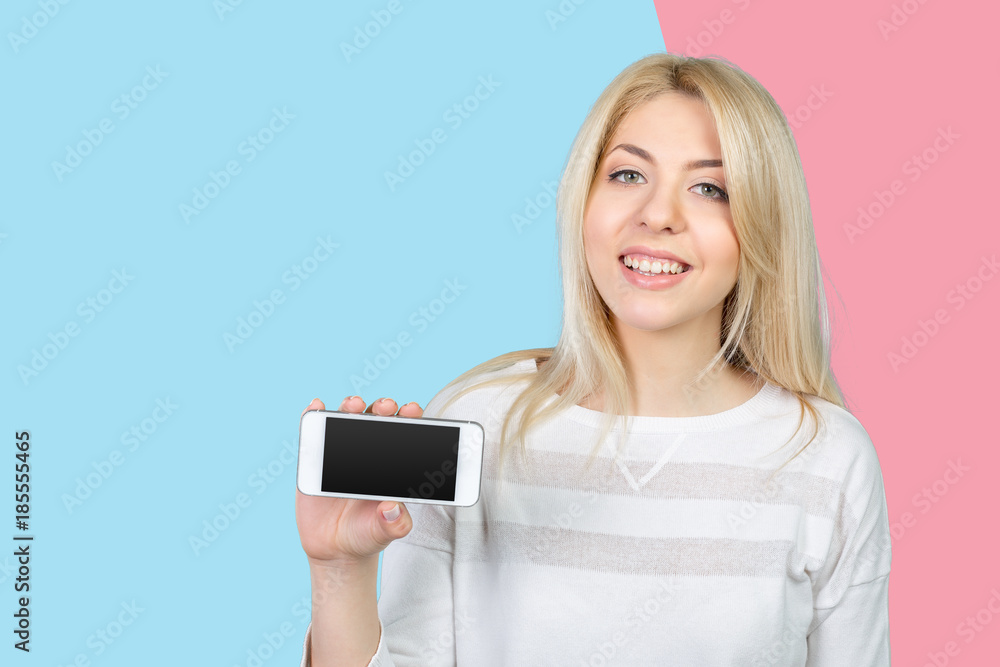 Happy pretty woman showing a blank smart phone screen Happy pretty woman showing a blank smart phone screen