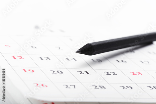 Check out the dates in a business calendar concept © fotofabrika